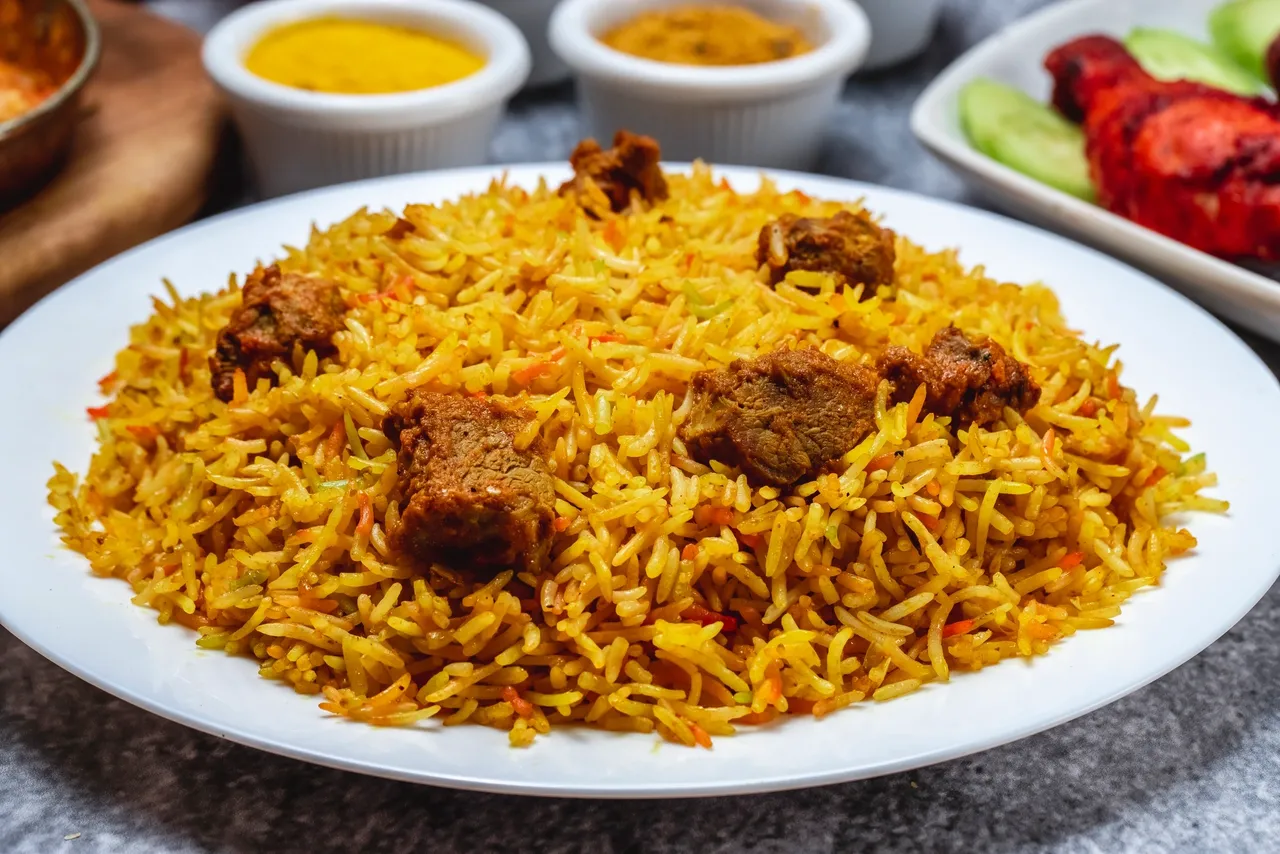 A plate of pilau and other sides offered in Mombasa nyali.