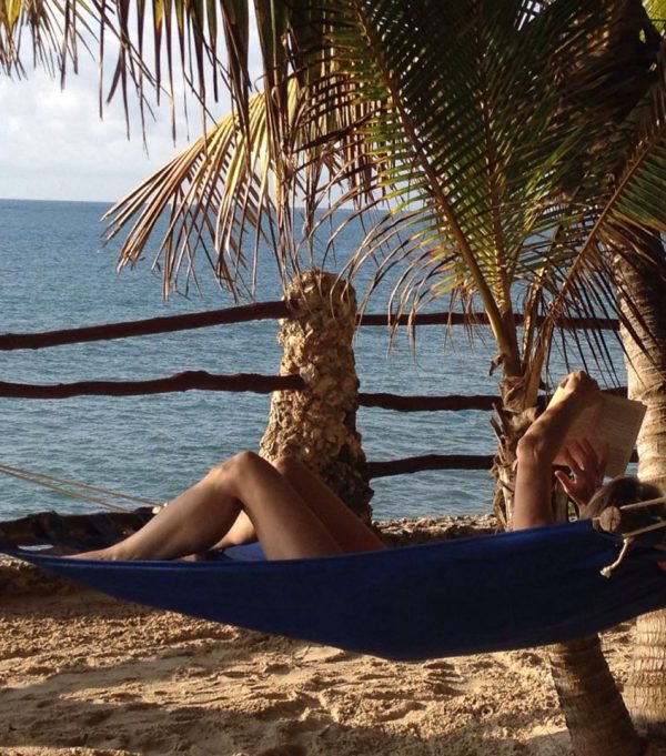 Woman relaxing on a hammock at the Bahari Beach Hotel Nyali Mombasa. Woman relaxing on a hammock at the Bahari Beach Hotel Nyali Mombasa.