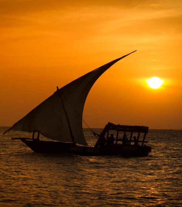 dhow sailing A dhow sailing on the Indian Ocean under the sunset, at Nyali mombasa.