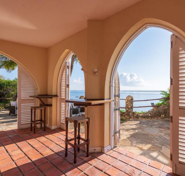 A view from the peponi bar's doors overlooking the blue sky and the Indian Ocean at Bahari Beach Hotel, Mombasa Nyali.