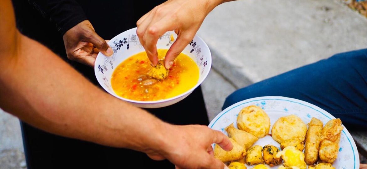 A group of people enjoying Swahili dishes.