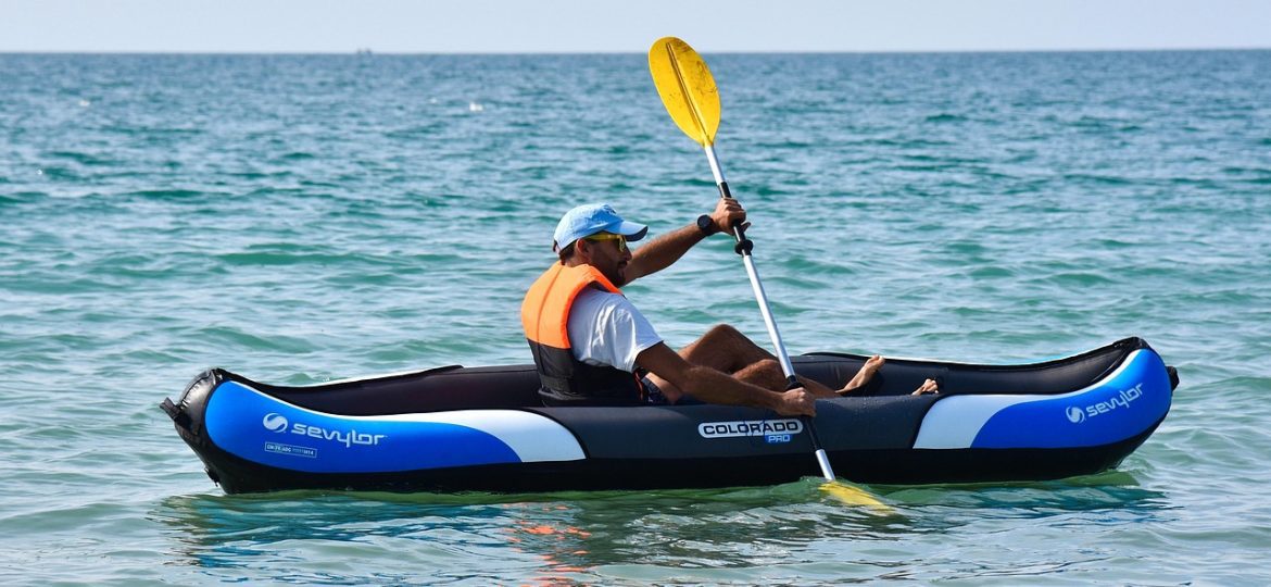 Man kayaking in the ocean.