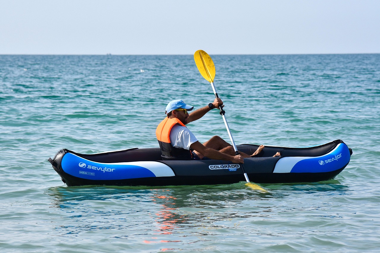 Man kayaking in the ocean.